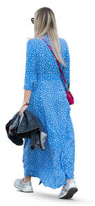 woman in a long blue summer dress walking