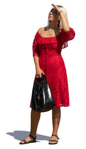 woman in a red dress standing and looking up