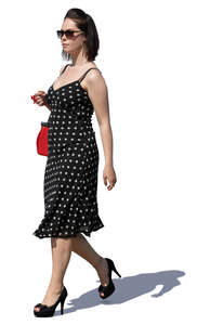 woman in a polka dot dress walking