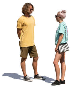 young man and woman talking on a sunny street