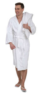 man in a white bathrobe walking