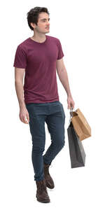 young man with shopping bags walking