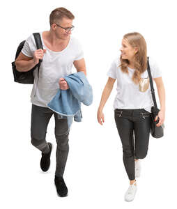 young cheerful man and woman walking seen from above 