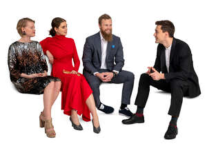 group of four young people at a party sitting and talking