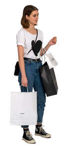 woman with many shopping bags standing