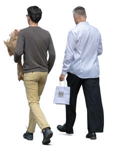 two men with flowers and a gift bag walking