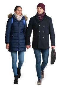 couple in winter coats walking hand in hand