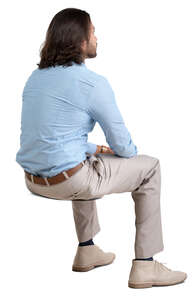 man sitting seen from back angle