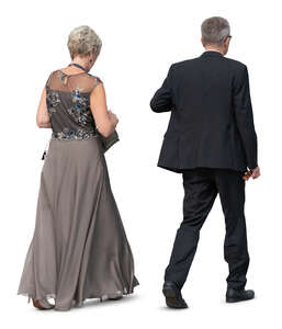 older couple in formal clothes walking