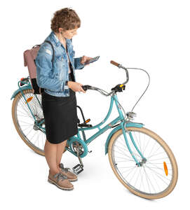 woman with a bicycle stopping and checking her phone