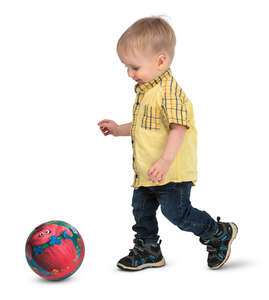 little boy playing with a ball