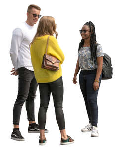 group of three young people standing and talking