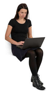 woman sitting with a laptop on her knees