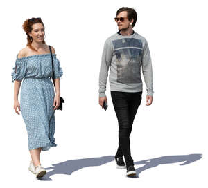 man and woman walking on a sunny day