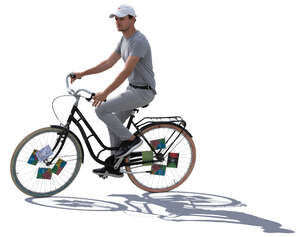 backlit young man riding a bike