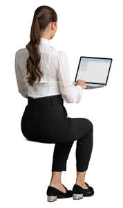 young woman sitting at an office table and working