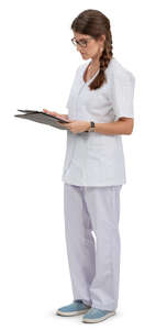 young nurse standing and reading some papers