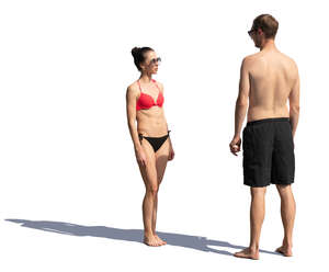 man and woman standing at the beach and talking
