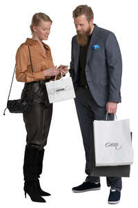 man and woman with shopping bags standing and discussing smth