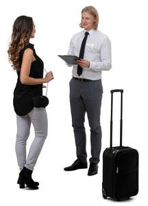 woman standing and talking to a hotel receptionist