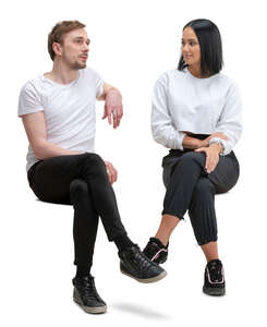 man and woman sitting and talking