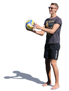 man holding a ball and smiling