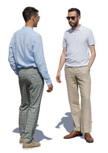 two men standing and talking