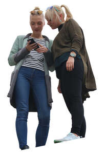 two women standing and looking at a phone seen from below