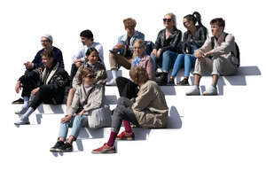 group of young people sitting on the stairs and talking