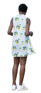 woman in a mini summer dress standing