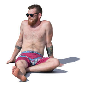 man sitting and sunbathing