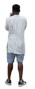 man in a striped shirt standing
