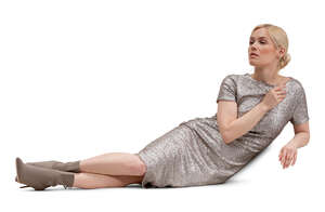 cut out woman in a glittering cocktail dress lying on a sofa