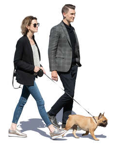 man and woman with a dog walking