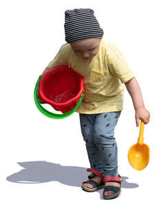 cut out little boy with a toy bucket playing