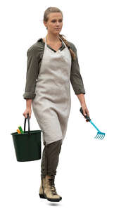 cut out woman with garden gear and apron walking