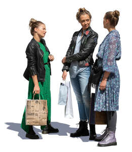 three cut out women with shopping bags standing and talking