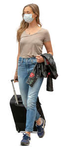cut out young woman with a protective face mask walking at the airport