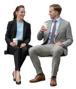 two business collegues sitting and drinking coffee