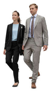 two cut out businesspeople walking down the stairs