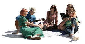 cut out group of young people sitting in a park and playing guitar