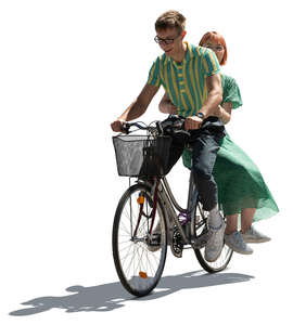 cut out young backlit couple riding a bicycle