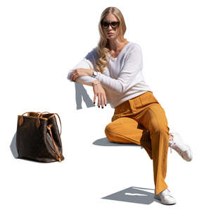 cut out woman sitting on a bench and leaning against the backrest