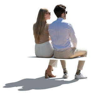 cut out backlit man and woman sitting seen from back angle