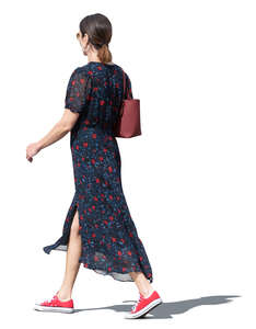 cut out woman in a long summer dress walking