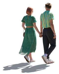 cut out young backlit couple walking hand in hand