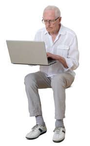 cut out older man sitting and working with laptop