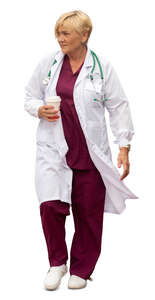 cut out female doctor with a coffee cuo in her hand walking hastily