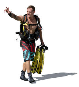 cut out man prepared to go diving walking on the beach