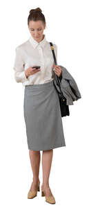 cut out businesswoman standing and checking her phone